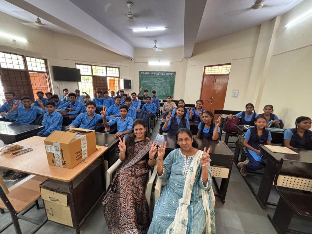 SAANJ volunteers with students in a classroom outreach program