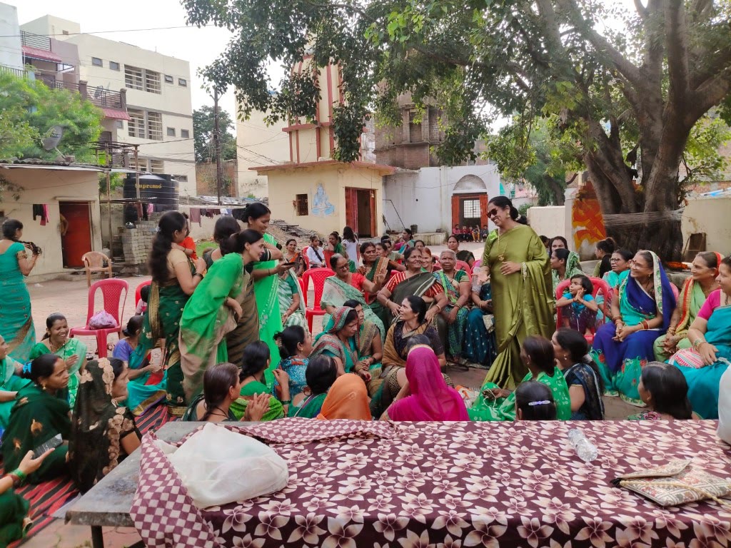 SAANJ volunteers leading a community gathering with local women